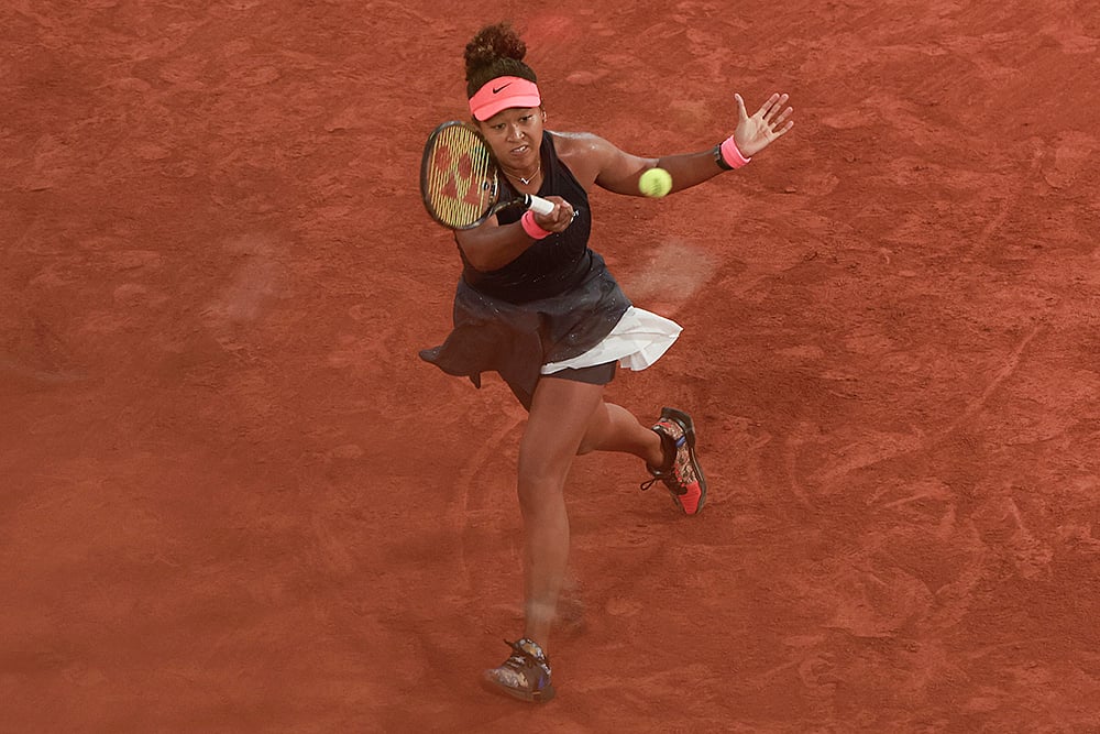 | Photo: AP/Aurelien Morissard : Naomi Osaka plays shot in French Open